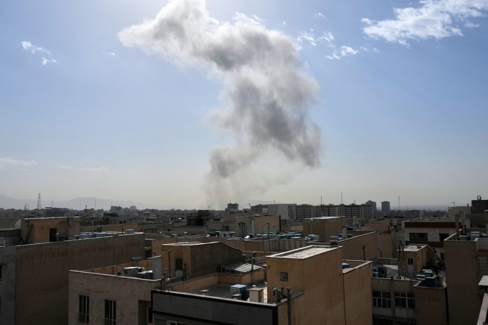 Smoke rises on the skyline after an explosion in Tehran, Iran (Vahid Salemi/AP)