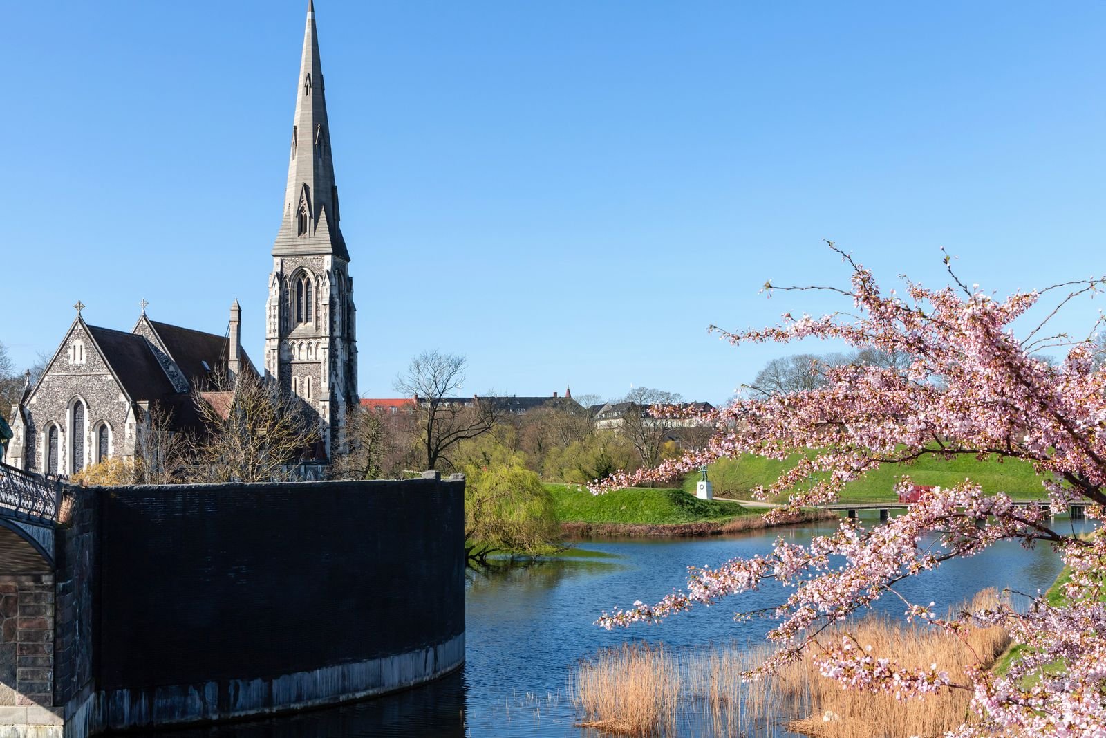 Image may contain Architecture Building Spire Tower Arch Cathedral Church Gothic Arch Outdoors and Water