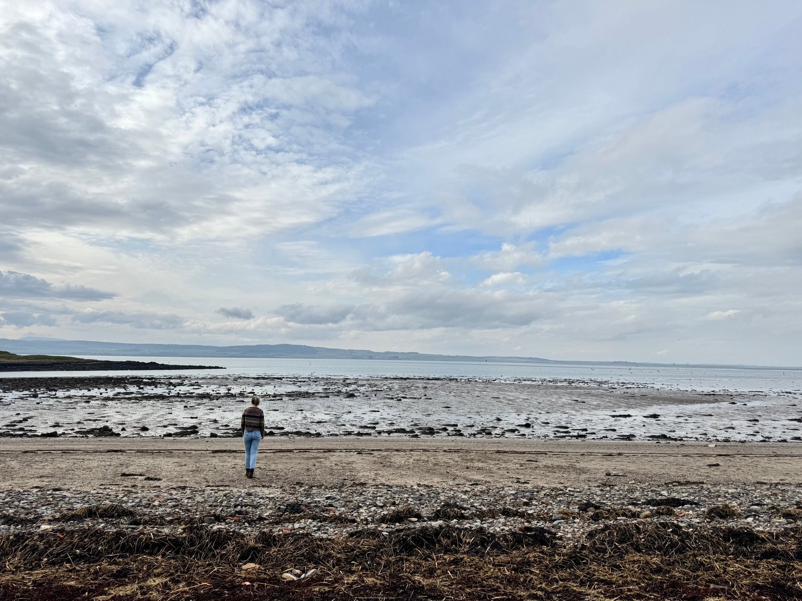 Helen on St Cuthbert’s Beach, looking across to the mainland