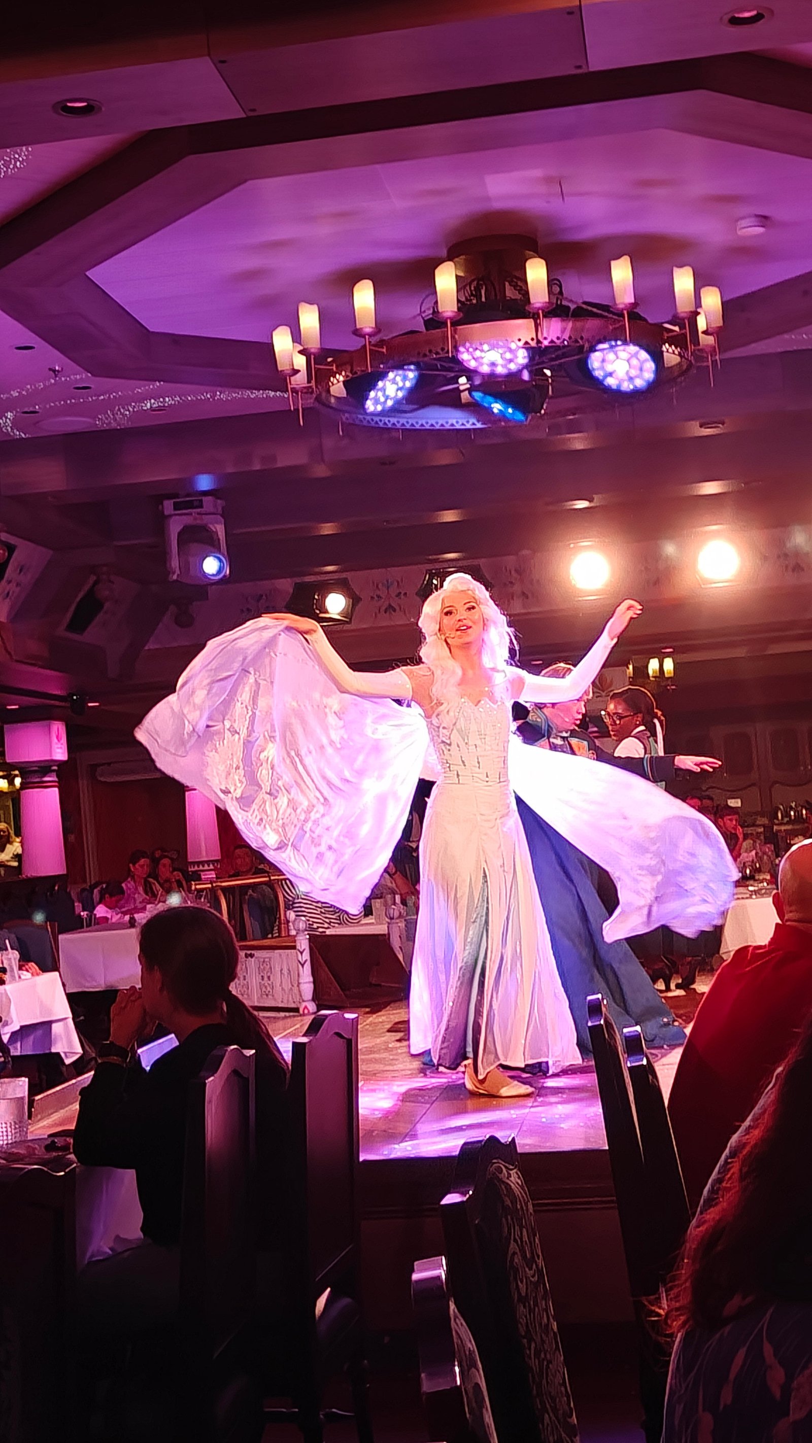Elsa entertains the crowds during an immersive Frozen-themed dinner aboard Disney Wish