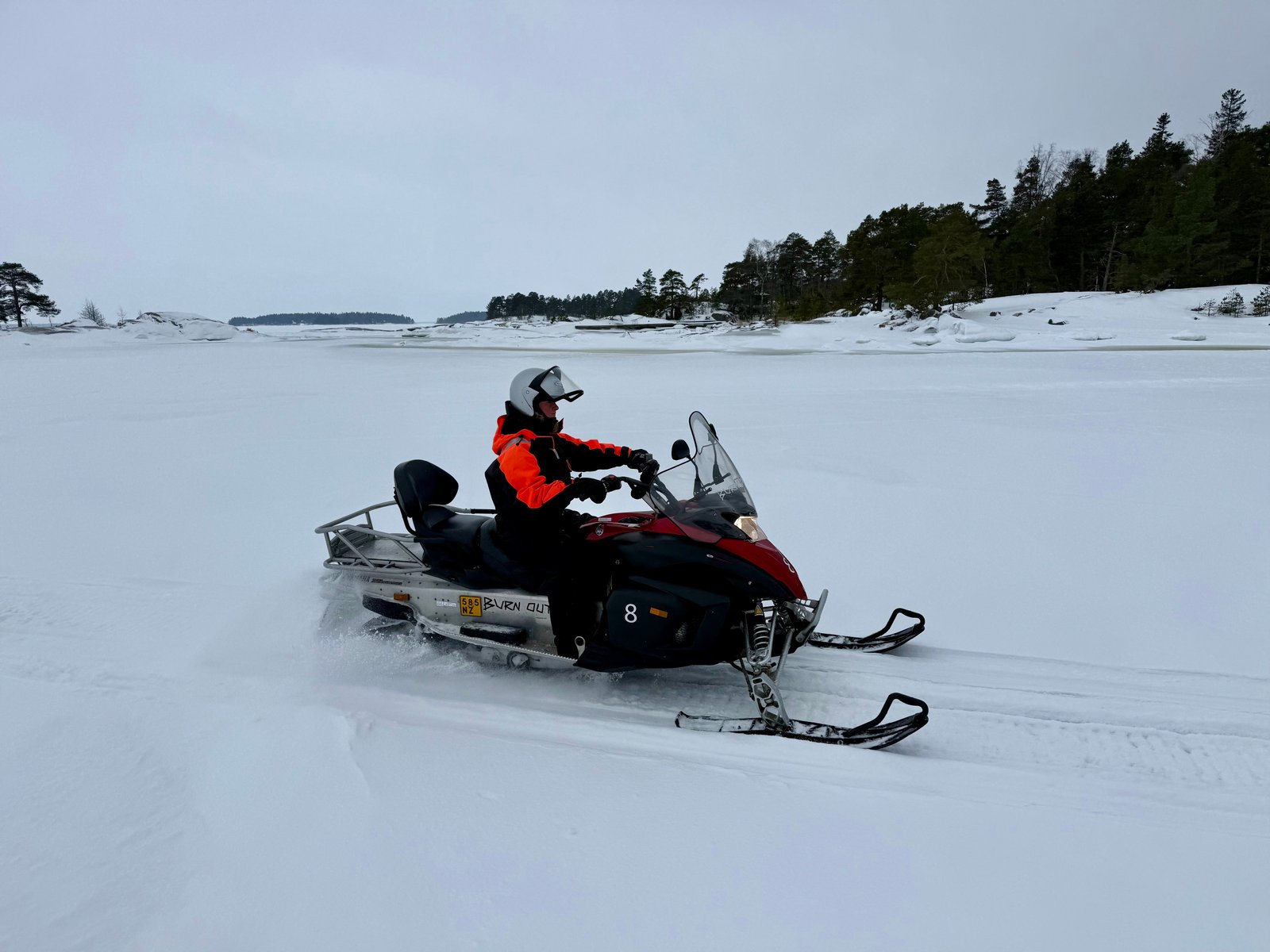 Snowmobiling between islands in the Helsinki archipelago