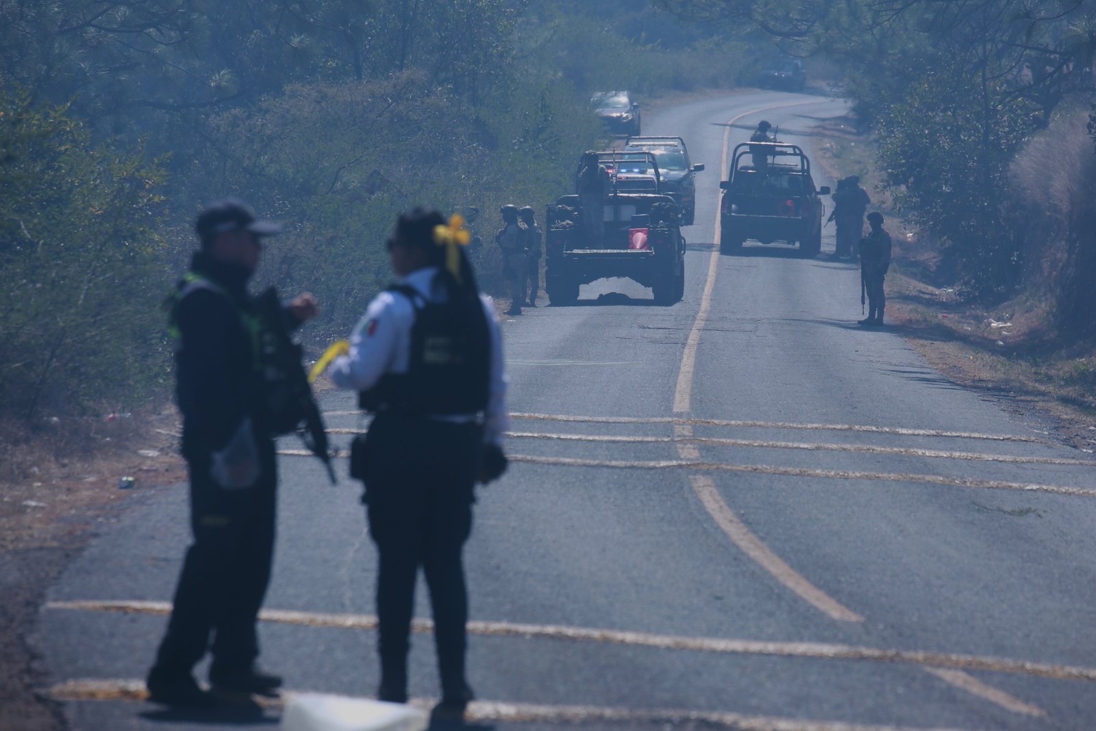 Soldiers stand guard in Cointzio, Michoacán state, Mexico, Sunday, Feb. 22, 2026, after the death of the leader of the Jalisco New Generation Cartel, Nemesio Rubén Oseguera Cervantes, known as 