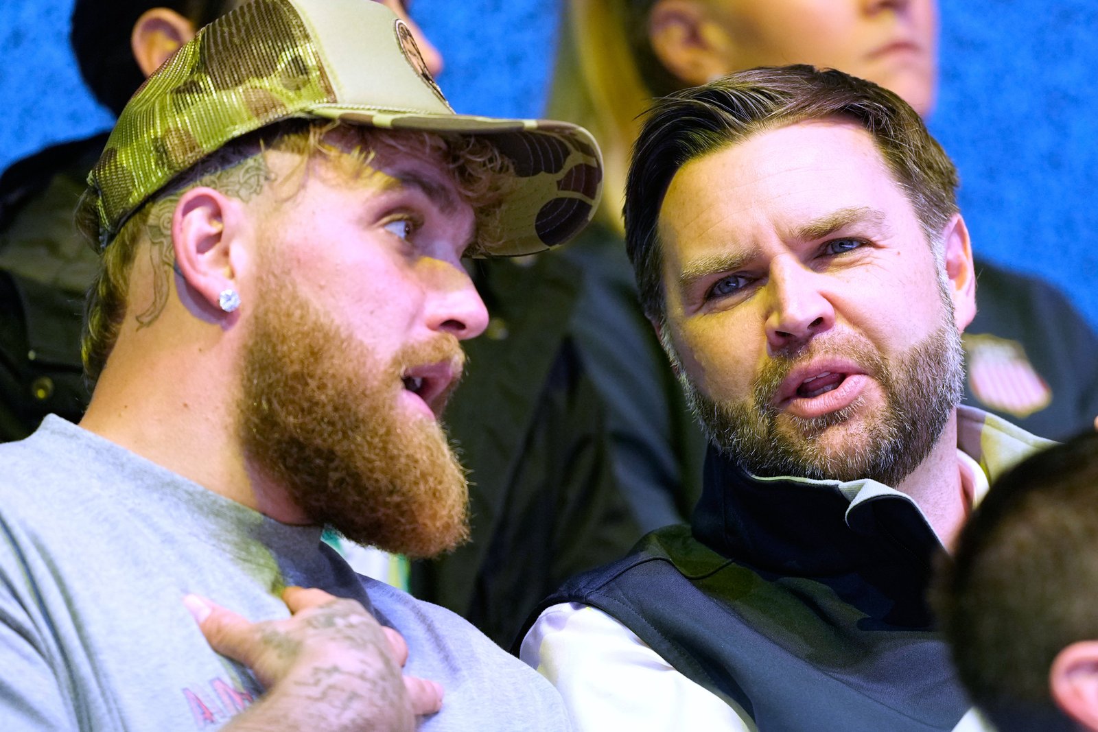 Jake Paul, left, and Vice President JD Vance attend a preliminary round match of women's ice hockey between the United States and Finland at the 2026 Winter Olympics over the weekend