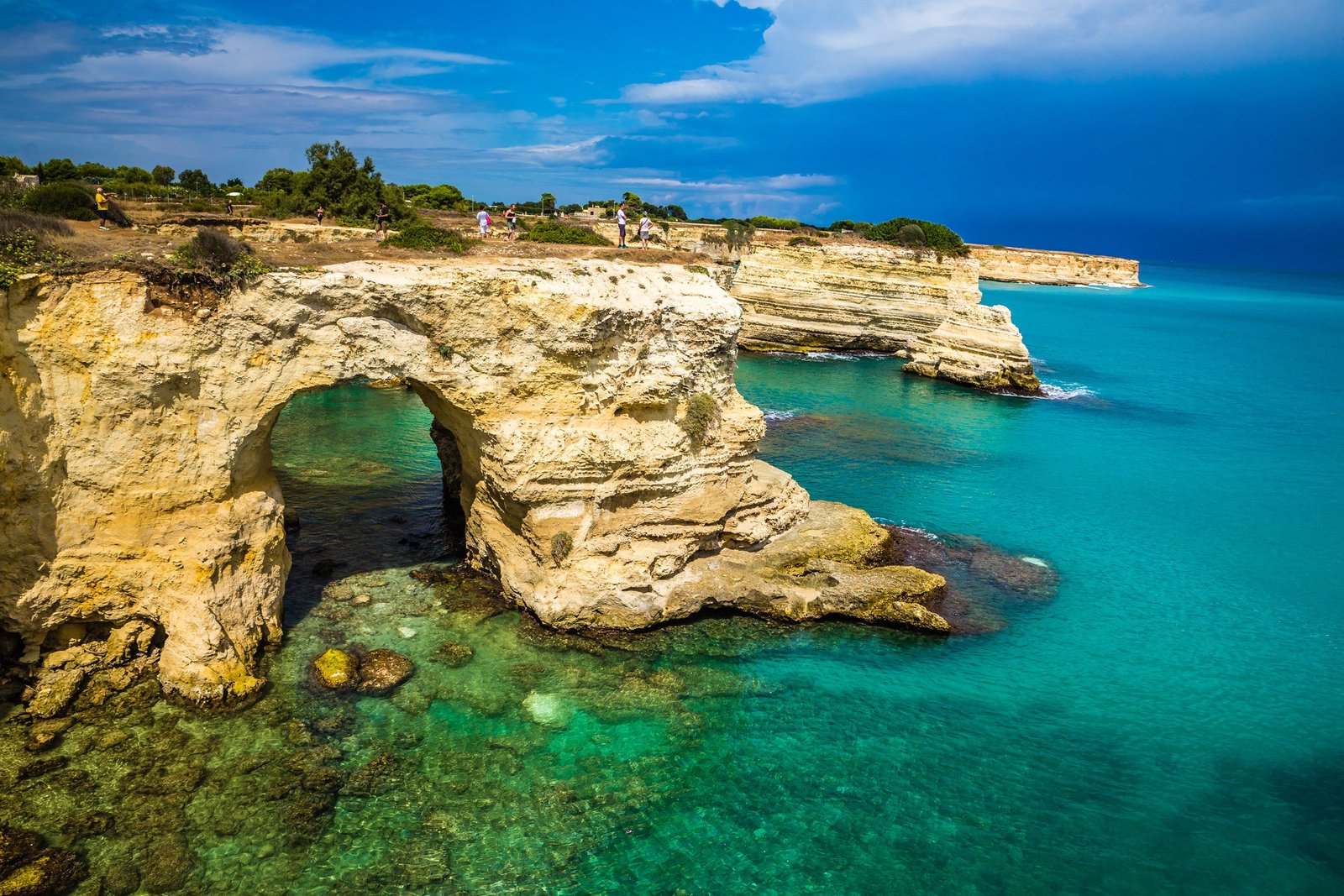 The natural arch, part of the Sant'Andrea sea stacks near the town of Melendugno in the southern region of Puglia, had long been a popular backdrop for wedding proposals and tourist photos