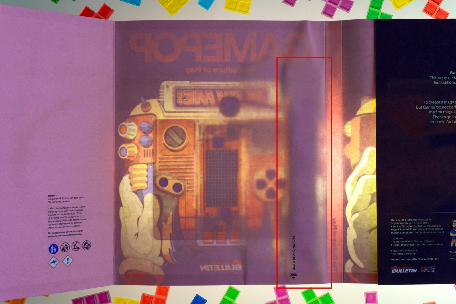 The Red Bull magazine’s cover illuminated from behind revealing some of its internal components.