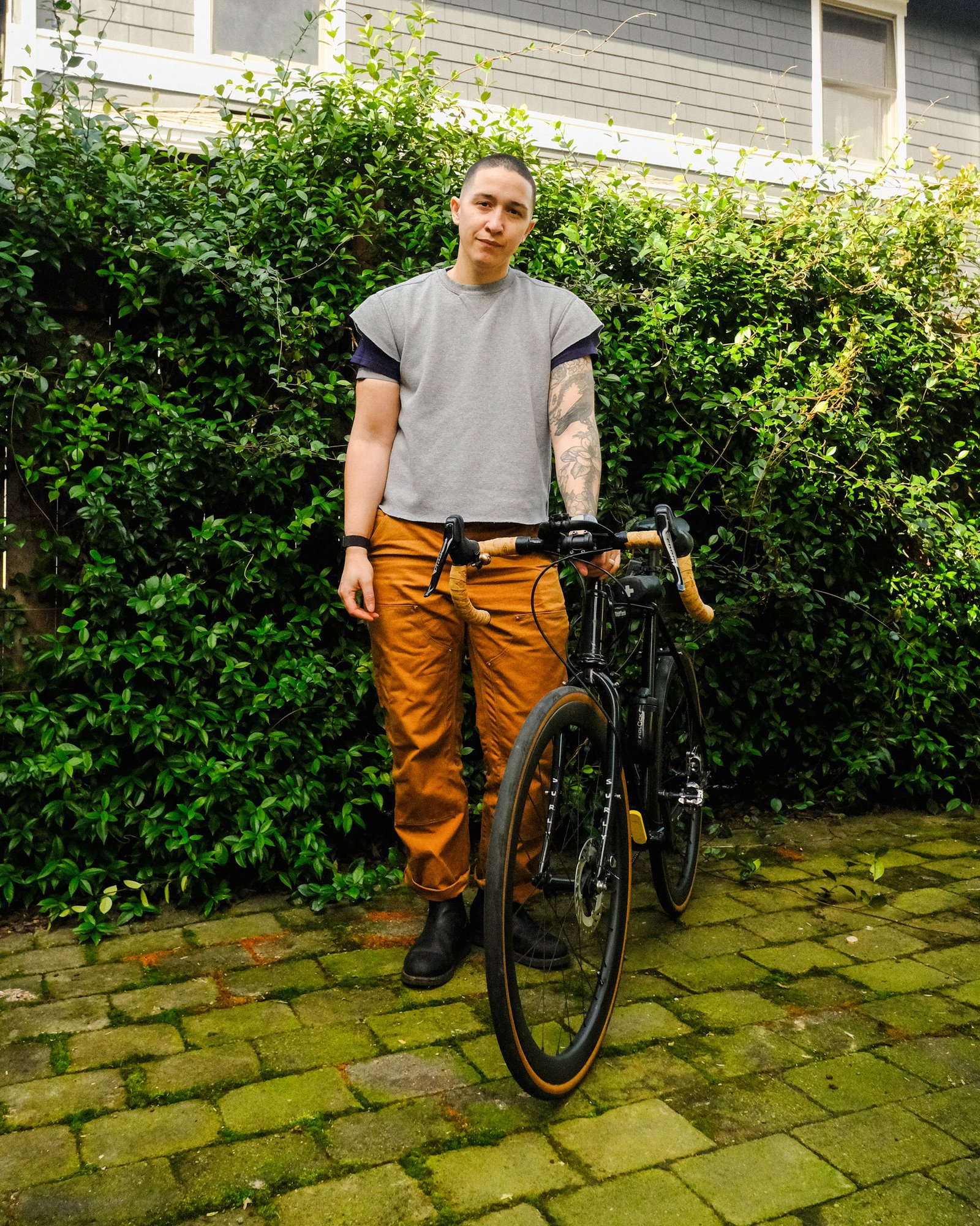 Arielle Duhaime-Ross does a bike tune-up outside.