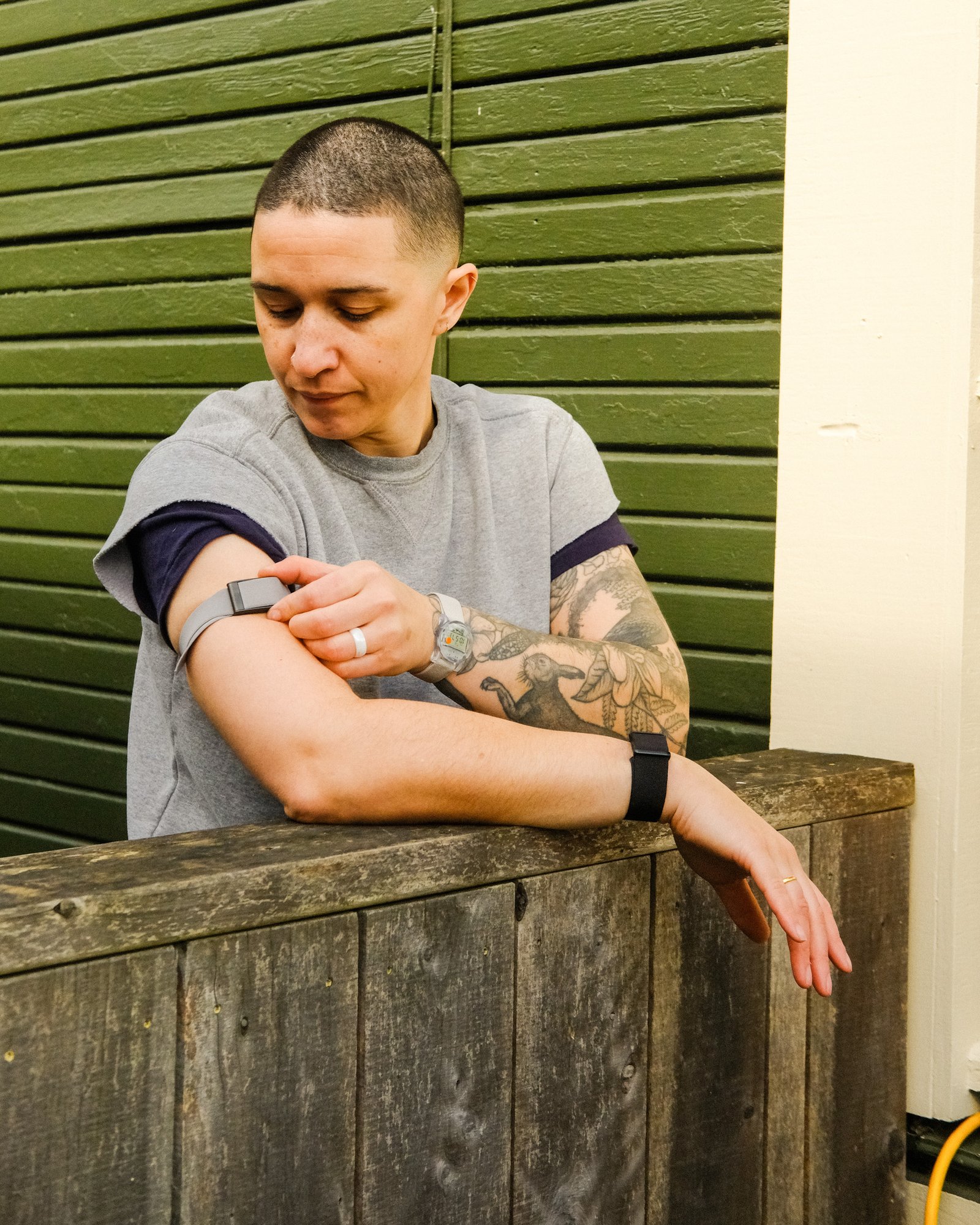 Arielle Duhaime-Ross checks their Whoop arm band.