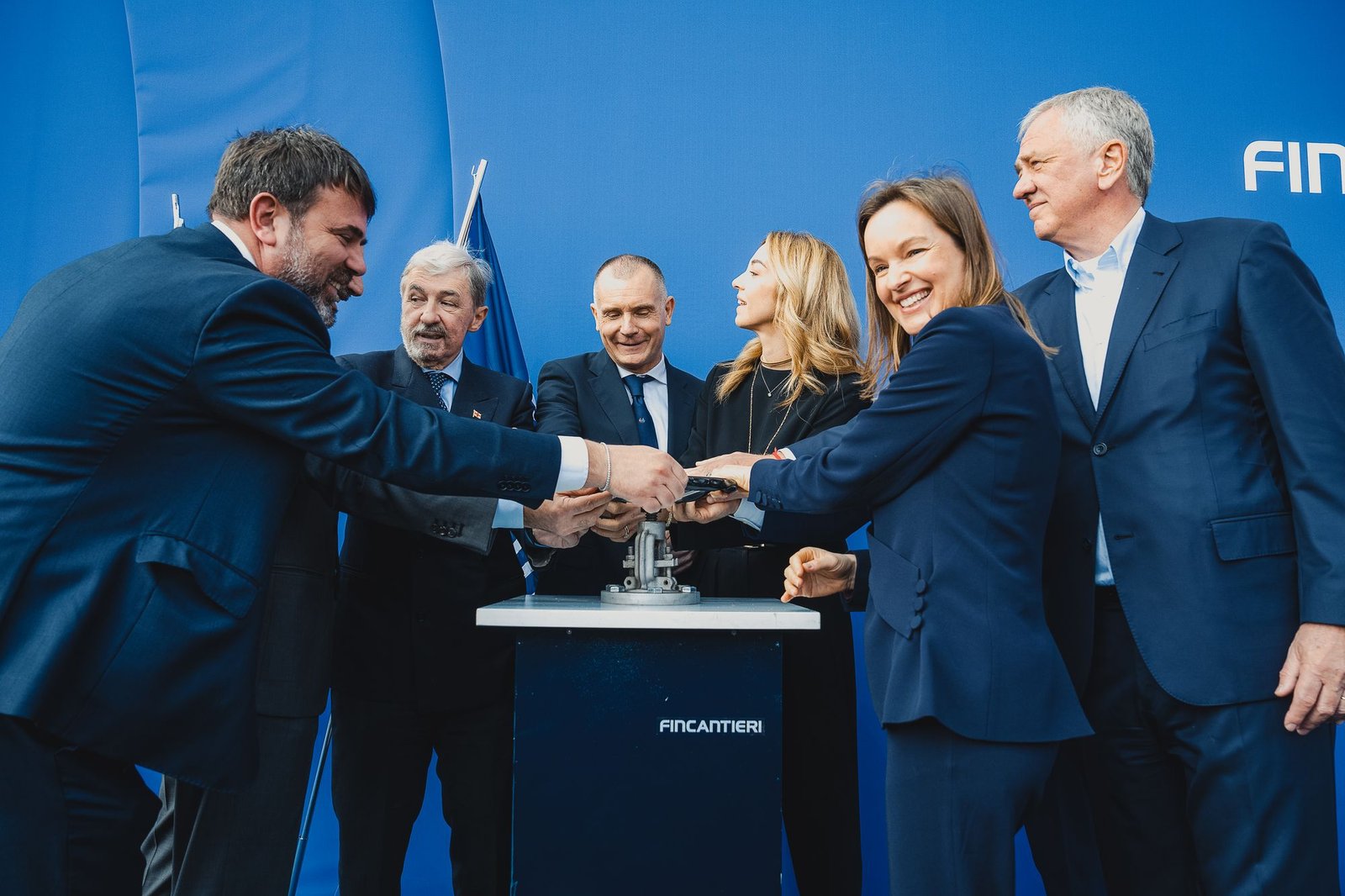 Anna Nash helps release the water for the float-out of Explora IV