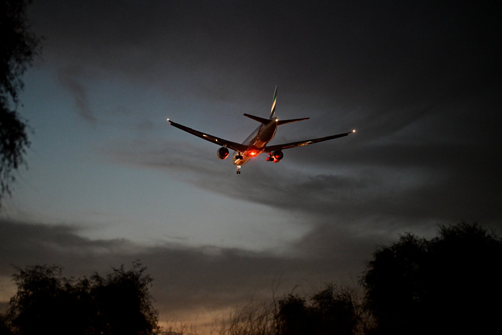 An Emirates Airlines flight prepares to land at Dubai International Airport on April 7, 2025