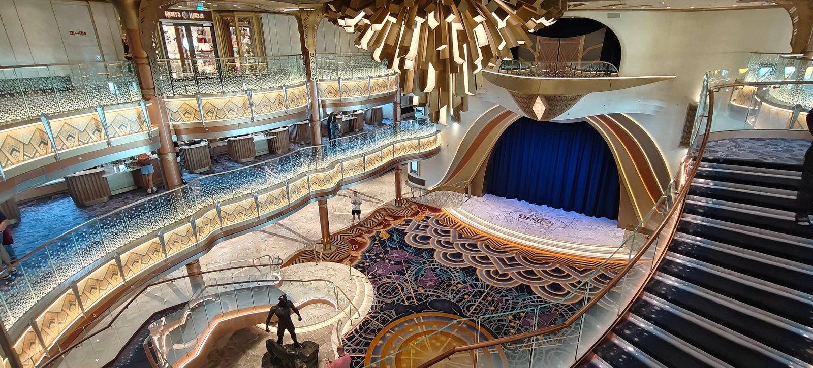 A Wakanda-style chandelier lights up the Grand Hall on Disney Destiny