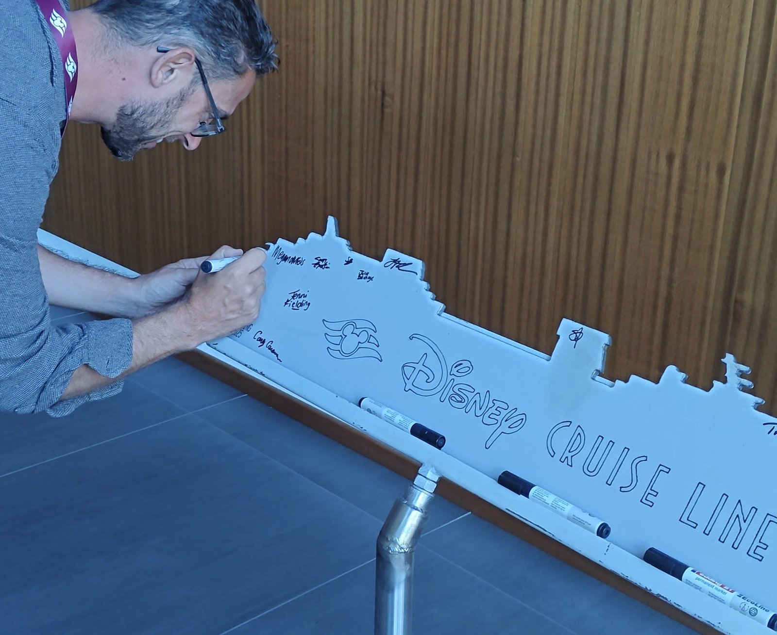 Cruise editor Marc Shoffman signed the first steel cutting of Disney Believe in August 2025