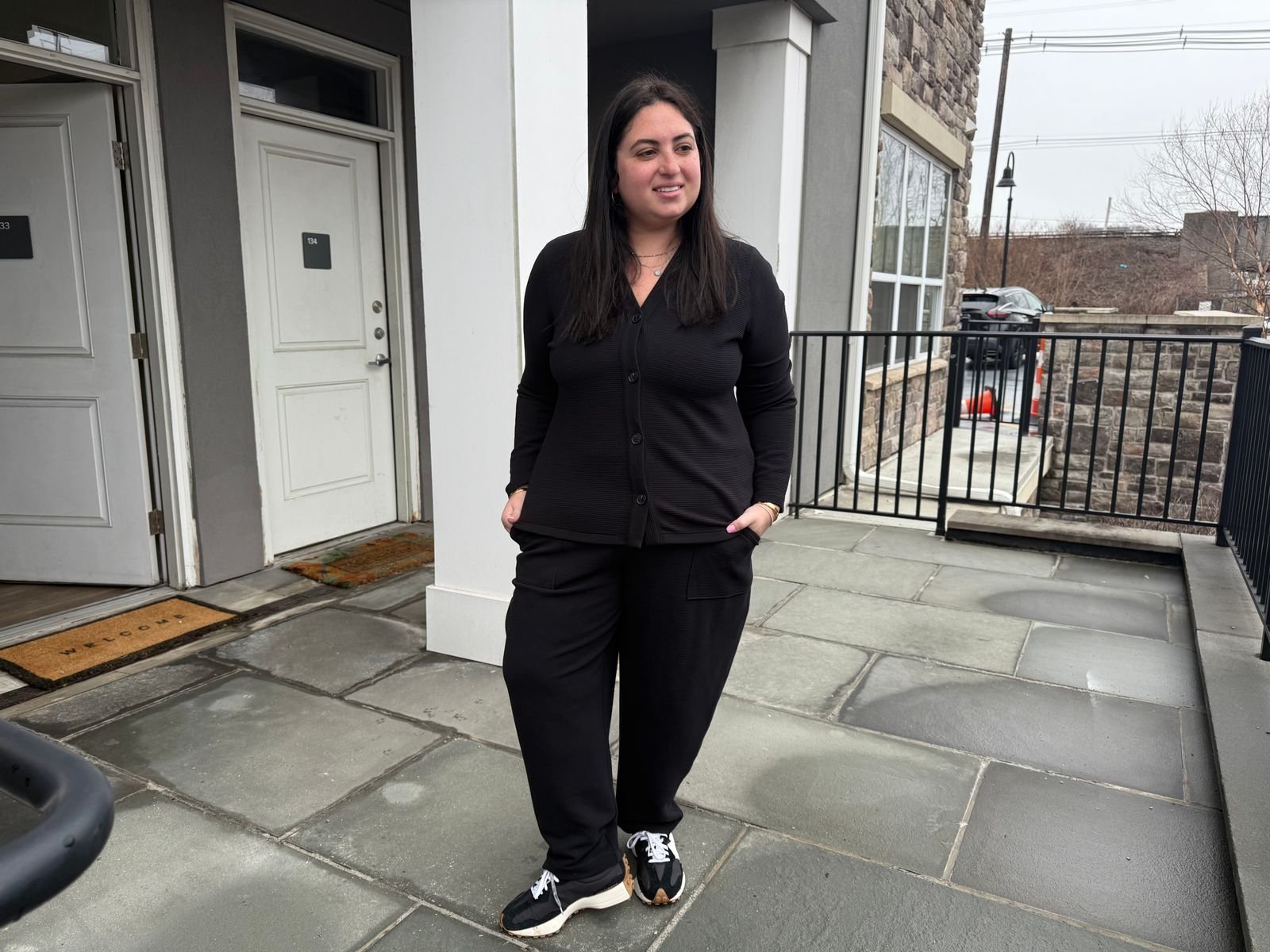 Image may contain Person Standing Adult Clothing Formal Wear Suit Black Hair Hair and Coat