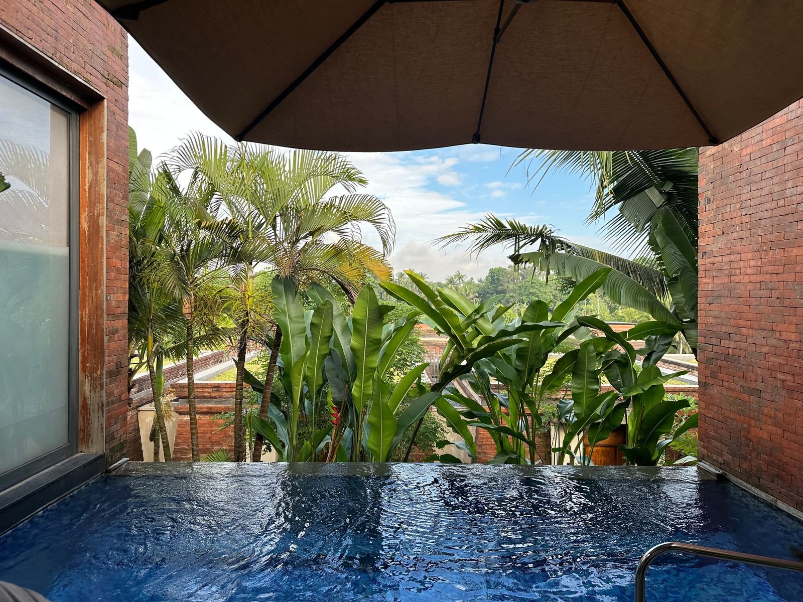 Image may contain Architecture Building Hotel Resort Pool Water Summer Swimming Pool Plant Vegetation and House