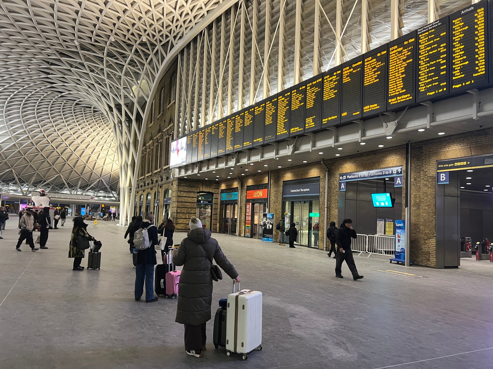 Cross purposes: Passengers at London King's Cross station waiting for delayed trains to Scotland