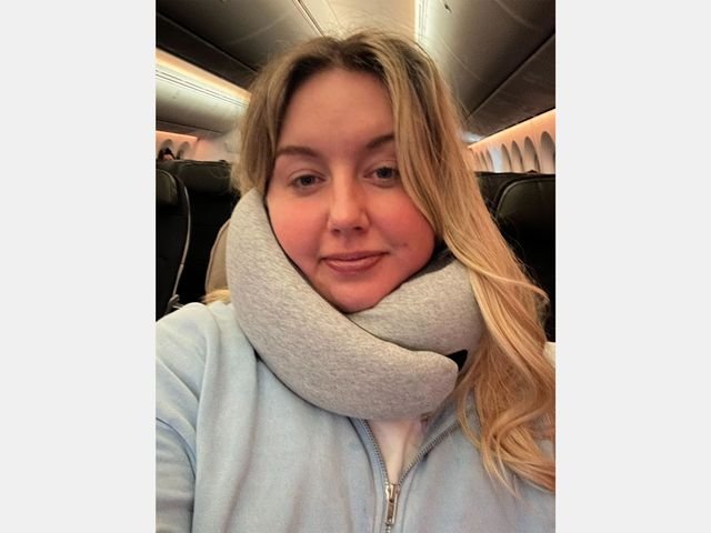 Image may contain: Blonde, Hair, Person, Face, Head, Photography, Portrait, Adult, Clothing, and Scarf