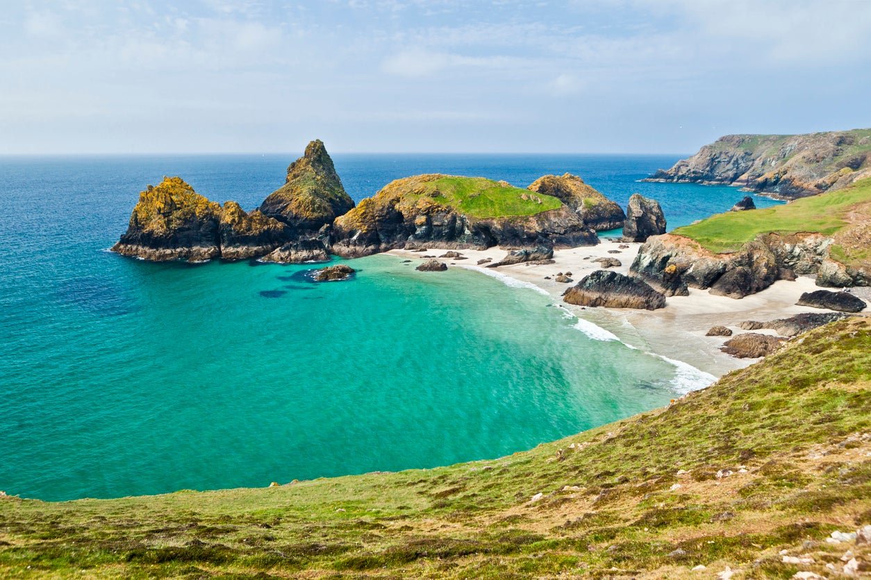 Visitors to Kynance Cove Beach need to be careful not to get cut off by the tide