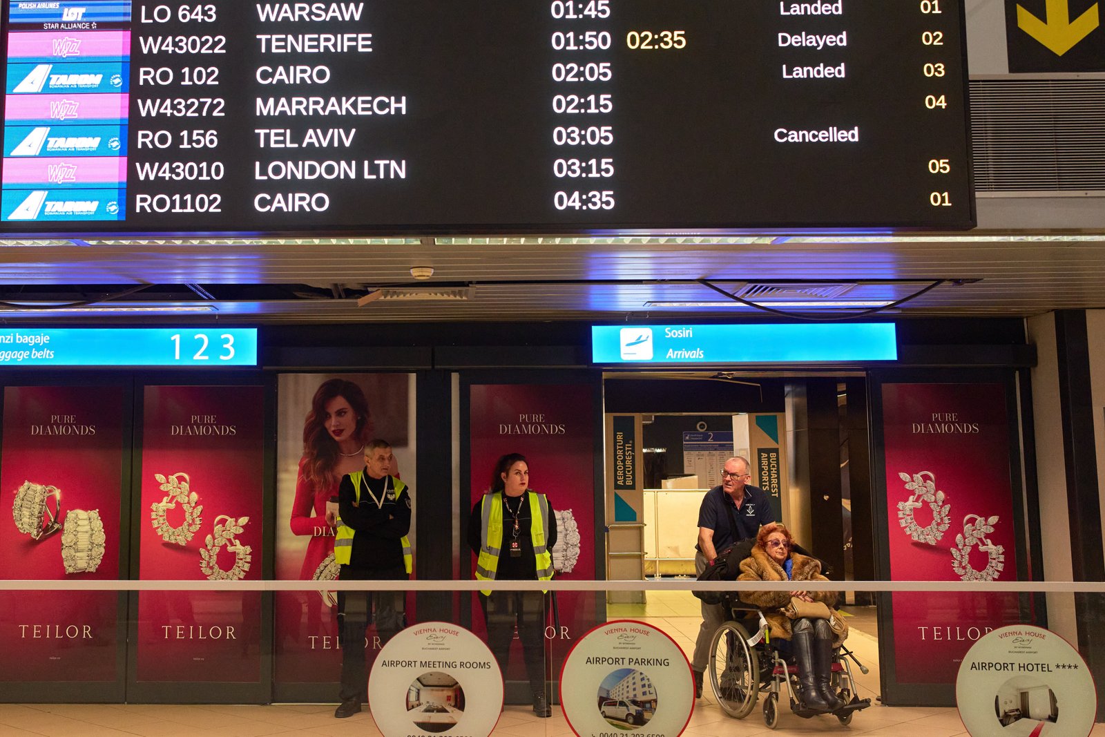 A display in the arrivals terminal of the Henri Coanda International Airport shows cancelled flights originating in Middle East countries
