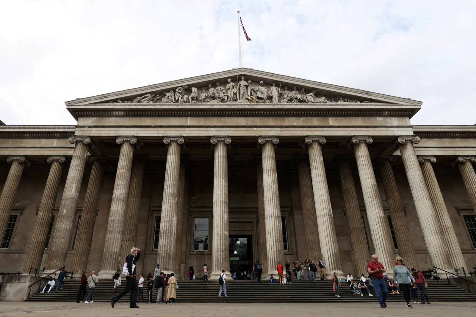 People walk in front of the British Museum in London