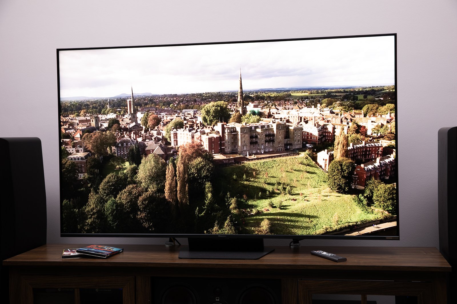Hisense UR9 RGB LED TV showing a flyover scene of a European village.