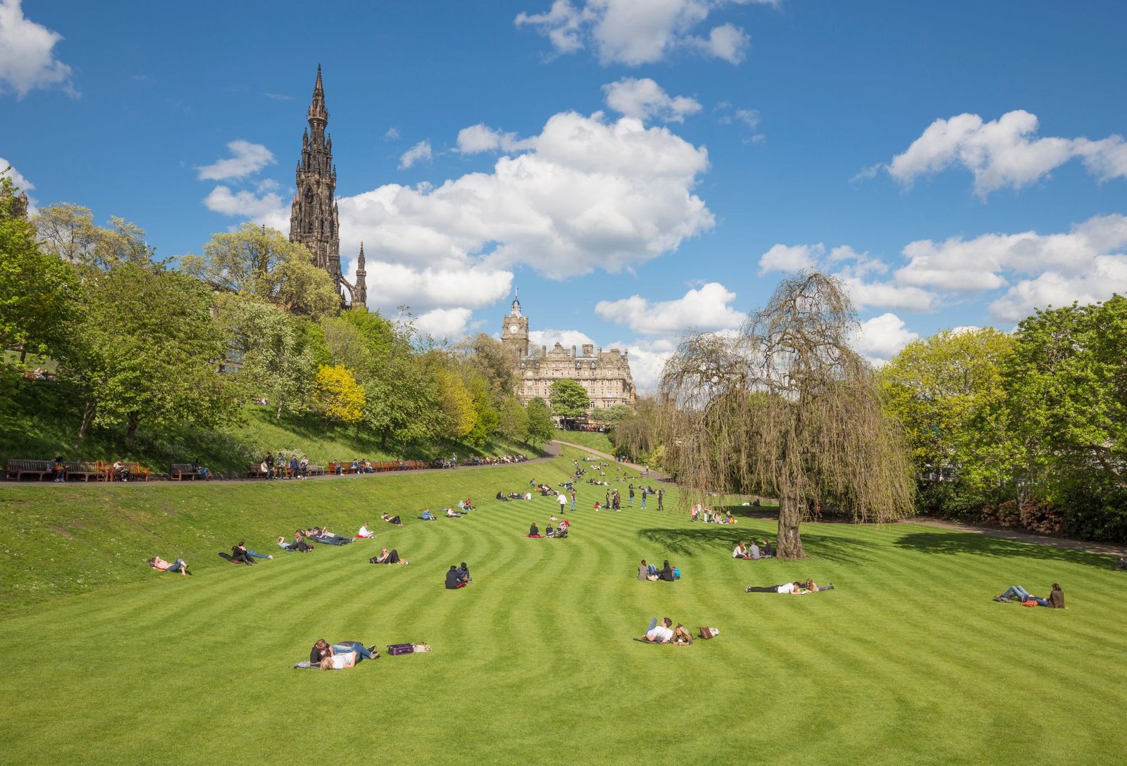 People enjoying the sun in Princes Street Gardens