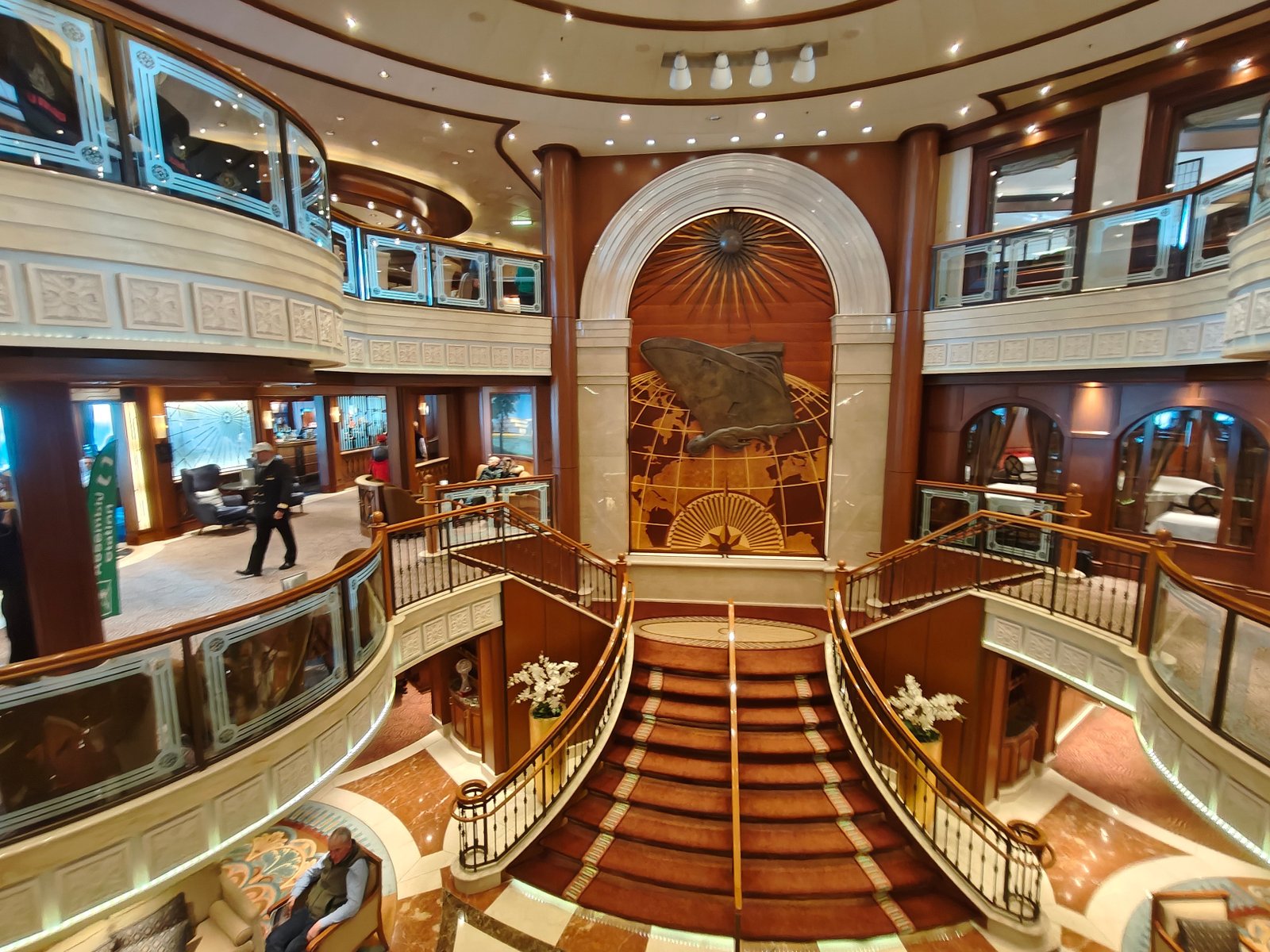 Cunard's Queen Victoria's grand staircase and regal decorations is a world away from modern-day megaships