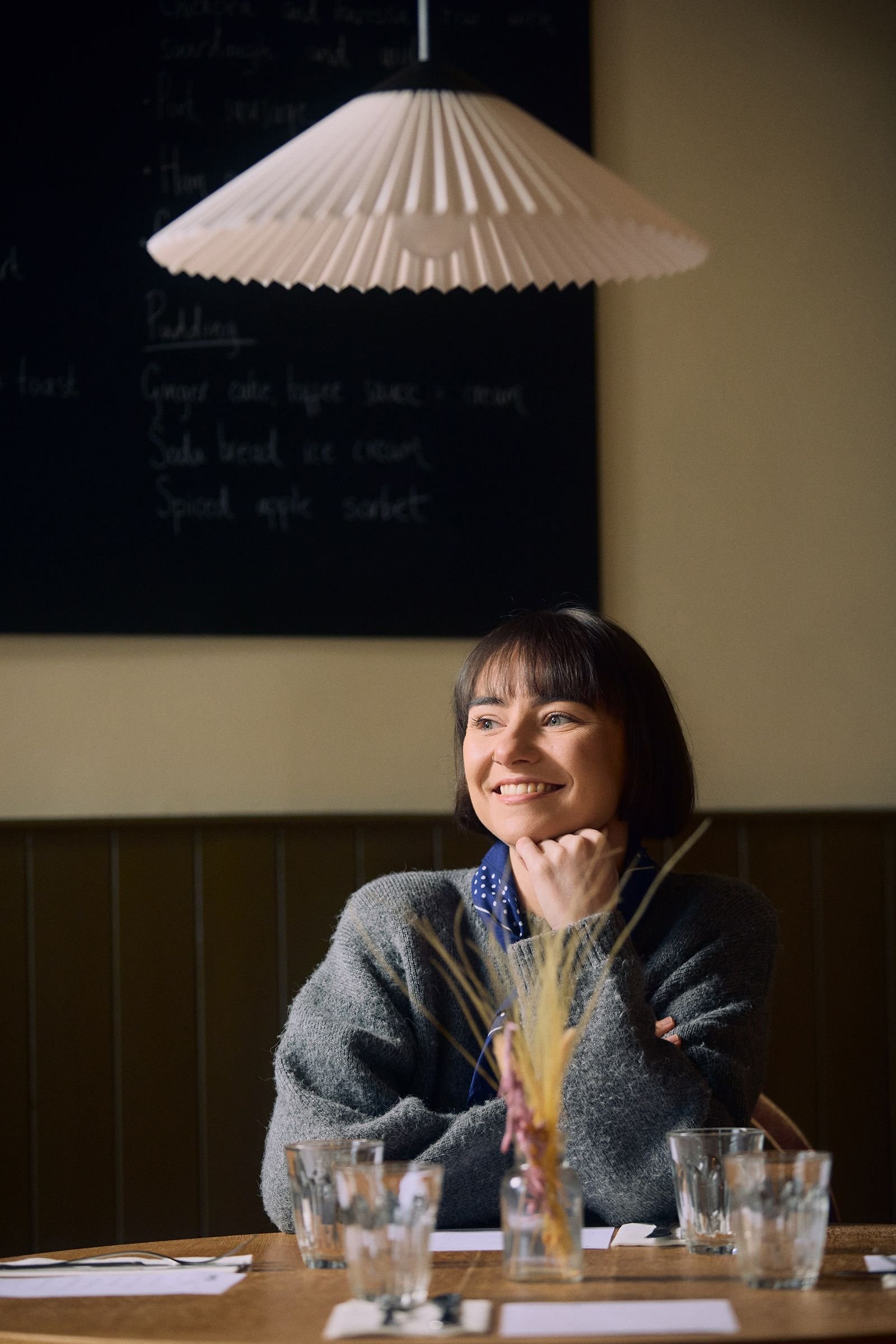 Image may contain Adult Person Face Head Photography Portrait Happy Smile and People