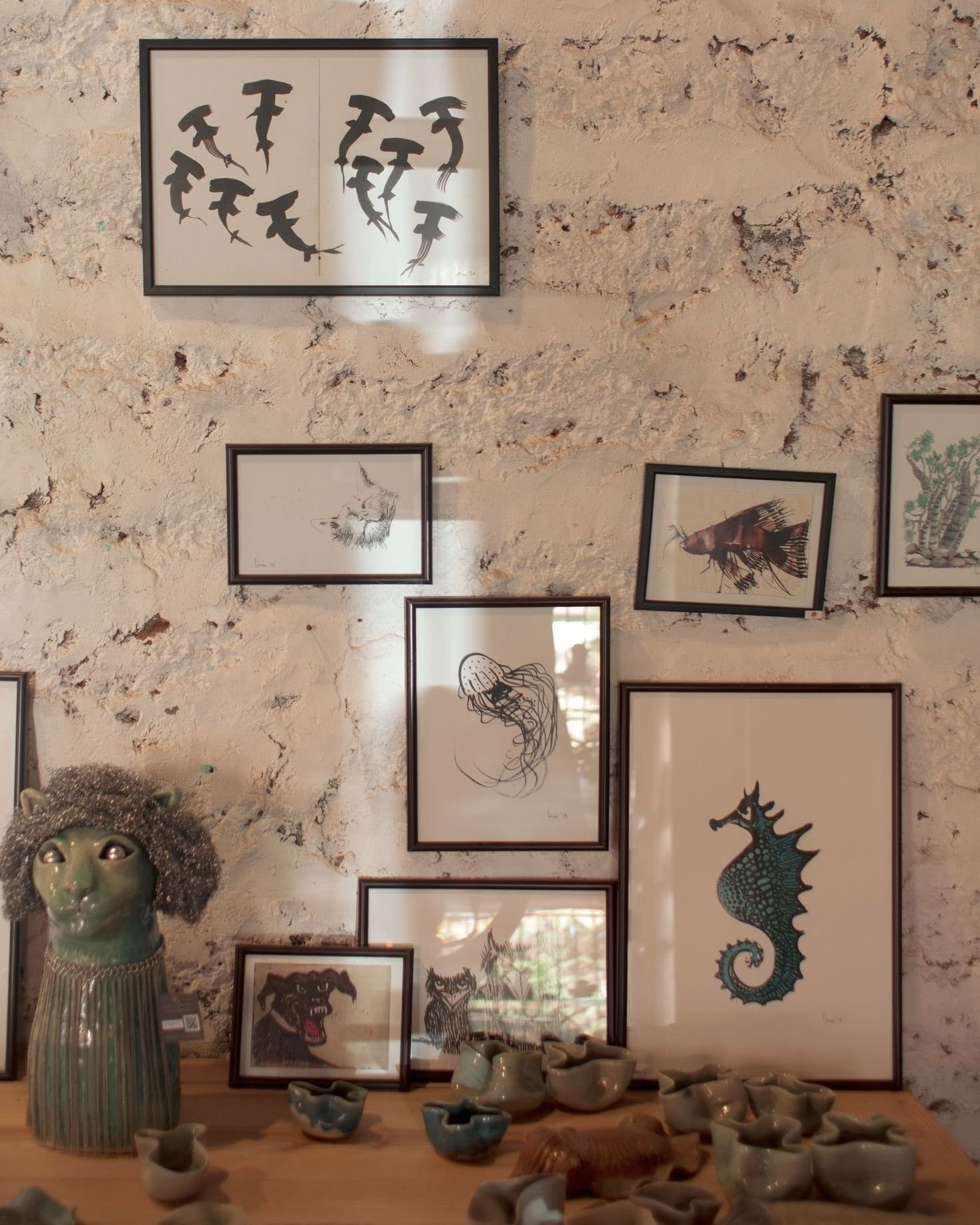 Image may contain Architecture Building Wall Person Art Painting Animal Fish Sea Life Face and Head