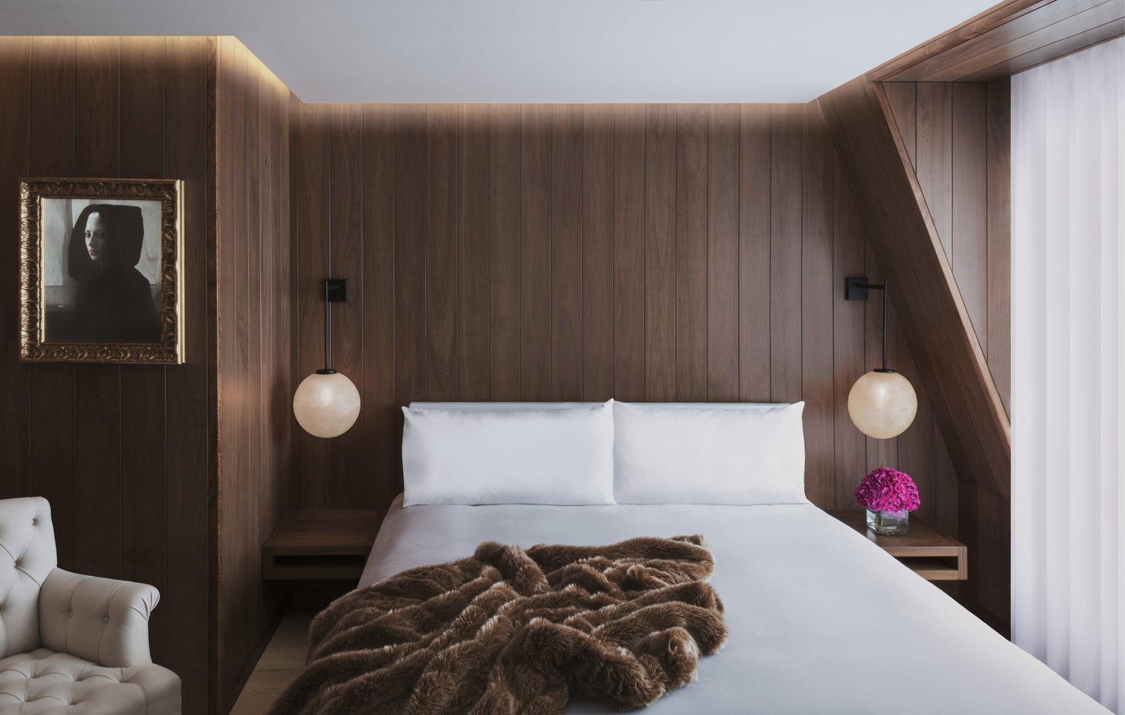 Wood-pannelled bedrooms lend the EDITION hotel a sultry feel